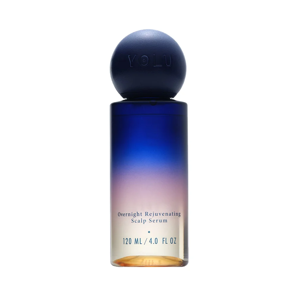 A blue-to-clear bottle labeled Overnight Rejuvenating Scalp Serum stands against a white background.