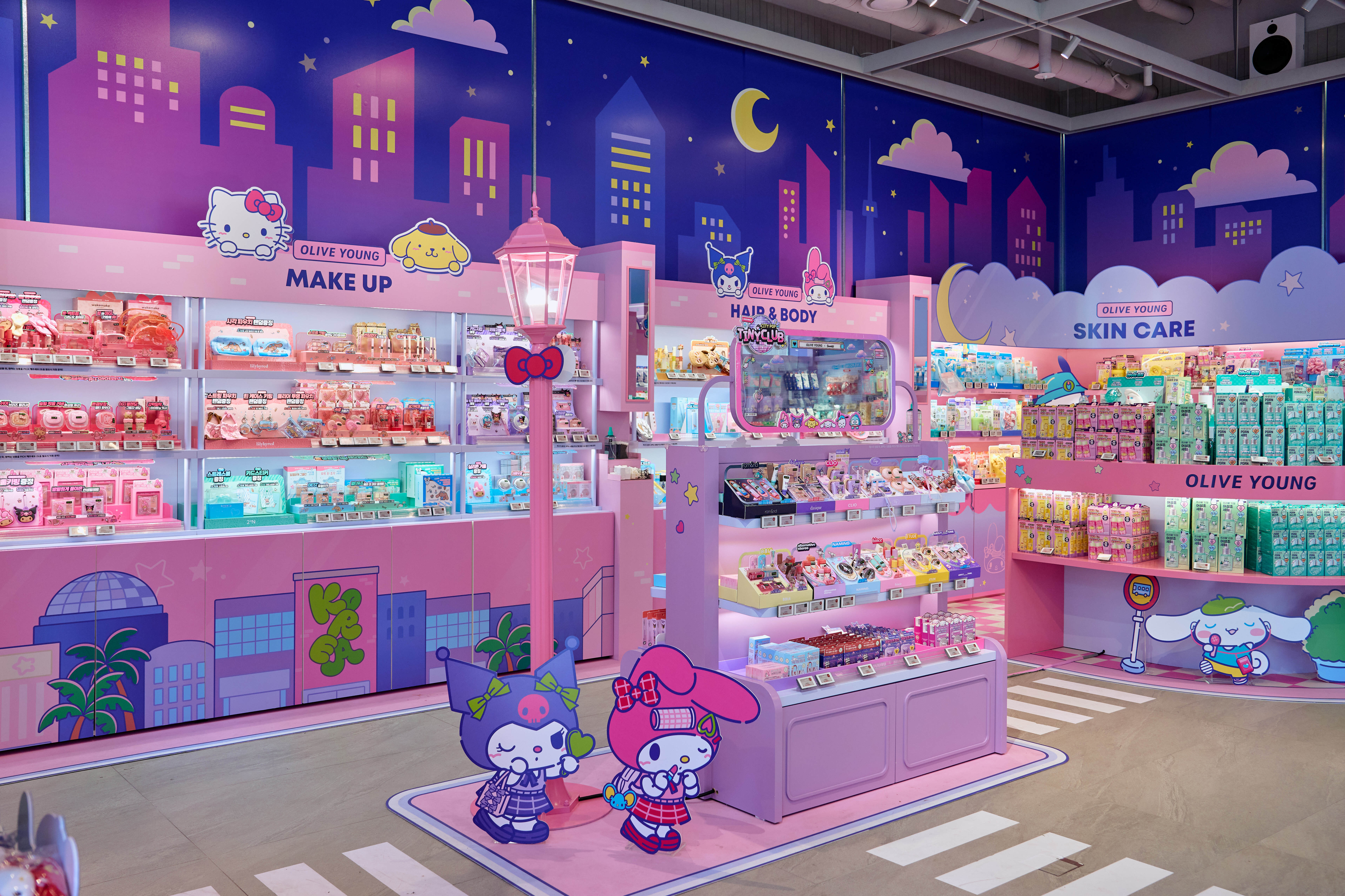 A colorful Olive Young store features cartoon characters and shelves of cosmetics.