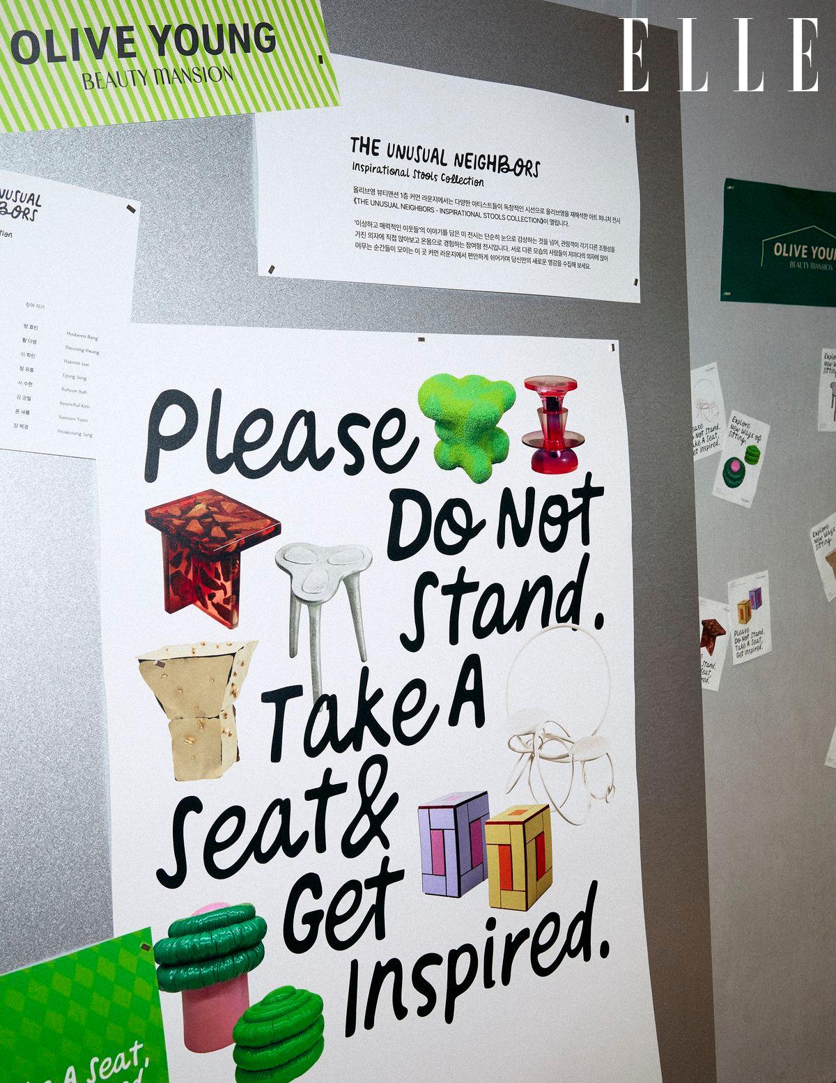 A gallery wall displays a poster urging visitors to take a seat and get inspired.