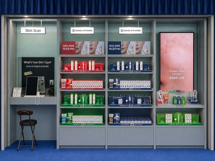 A display features a skin scan station and shelves of boxed skincare products at OLIVE YOUNG N Seongsu